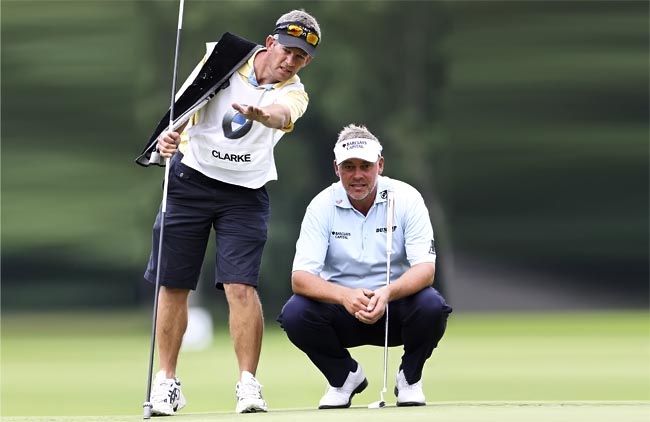   Clarke e o ex-caddie: demitido depois que o norte-irlandês não passou o corte no torneio de golfe de Abu Dhabi