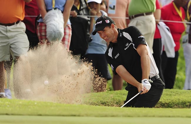    Harrington: jogando três abaixo no poço da serpente para tirar seu golfe do buraco aonde estava